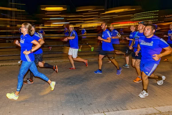 Group of runners with motion blur on the streets of Soder at Mid — Stok fotoğraf