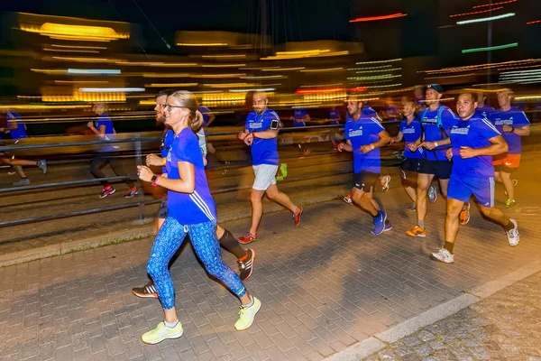 Group of runners with motion blur on the streets of Soder at Mid