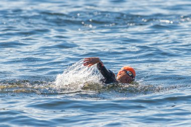 Woman triathlete swimming in closeup at Womens ITU World Triathl