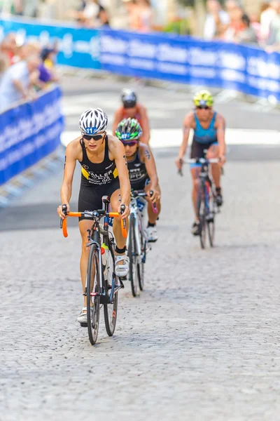 Sophia Saller (GER) leading a group down on the cobblestones at — Stockfoto