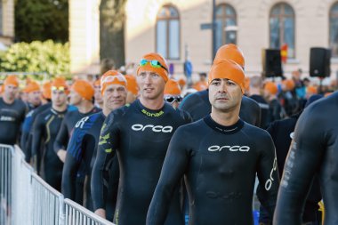 Determined triathletes walking to the starting area at ITU World