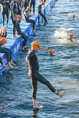 Man jumps into the water for the start in early morning at ITU W