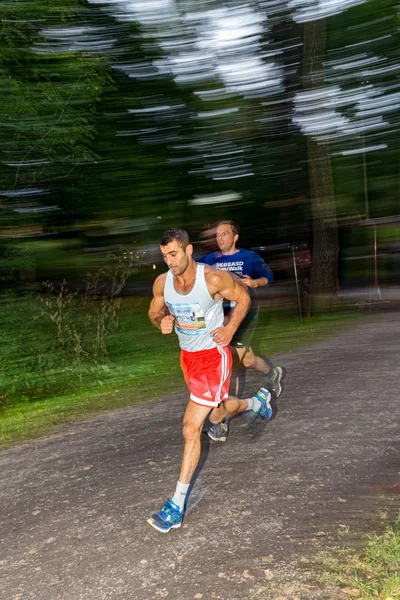 Male runners in motion blur in forest at the event 5K EASD Run W — ストック写真