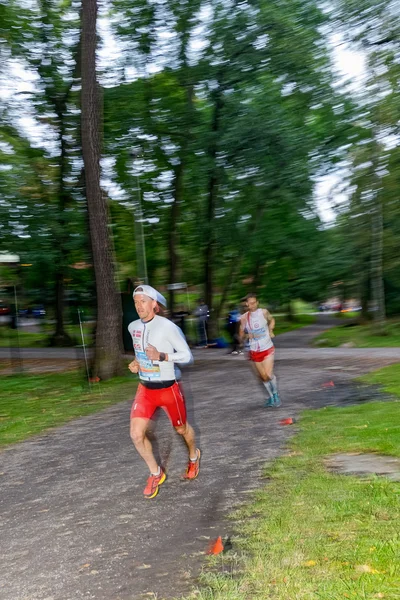 Male runners in motion blur in forest at the event 5K EASD Run W — Stok fotoğraf