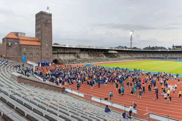 Warmup with aerobics before the race at the Stockholm Olympic St — Stock Photo, Image