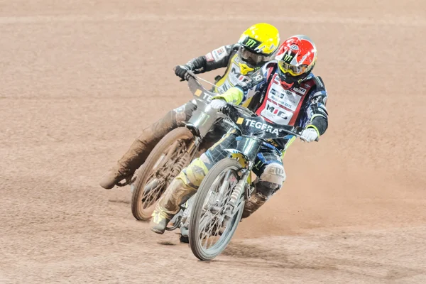 Speedway drivers in a curve at the TEGERA Stockholm FIM Speedway — Zdjęcie stockowe