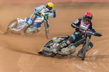 Tai Woffinden before Nicki Pedersen in a curve at the TEGERA Sto