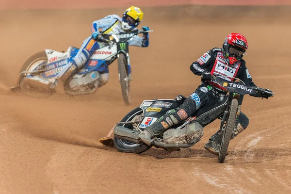 Tai Woffinden before Nicki Pedersen in a curve at the TEGERA Sto