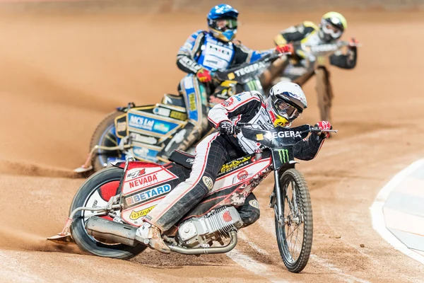 Great action image of speedway racer Maciej Janowski going into — стокове фото