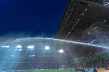 Tele2 Arena with water sprinklers before the derby soccer game b