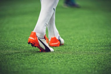 Closeup of soccer legs and feet in the game between Djurgarden a