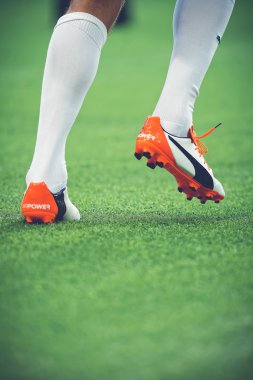 Closeup of soccer legs and feet in the game between Djurgarden a