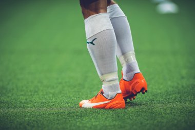 Closeup of soccer legs and feet in the game between Djurgarden a
