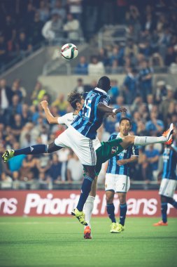 Colley and Haglund jumping for the ball at the soccer game betwe
