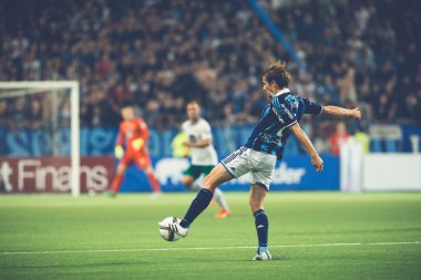 Jesper Karlstrom kicking the ball at the soccer game between the