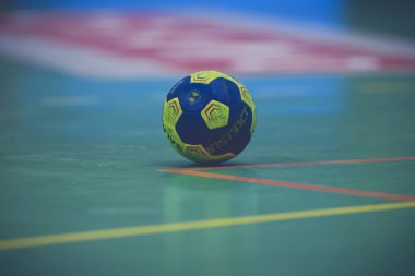 Closeup of the match ball on the floor at the Handball game betw