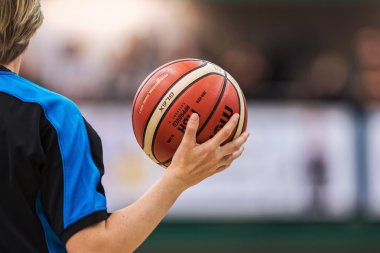 Closeup of referee holding ball at the Women European Basketball
