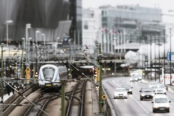 Traffic with a train and road traffic at Stockholm cental statio — 스톡 사진