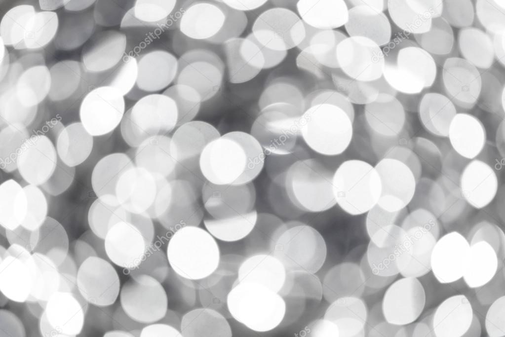 Defocused white lights during winter evening in city