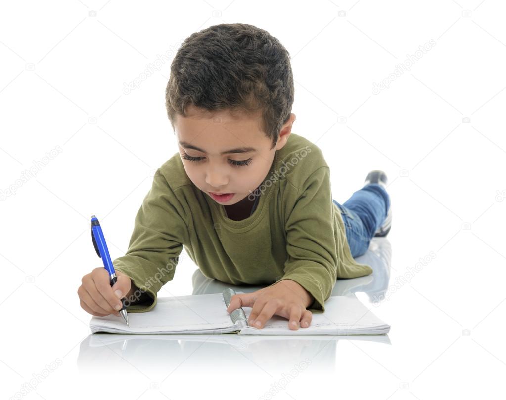 Cute Young Schoolboy Writing