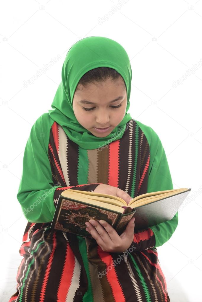 Little Young Muslim Girl Reading Book of Quran