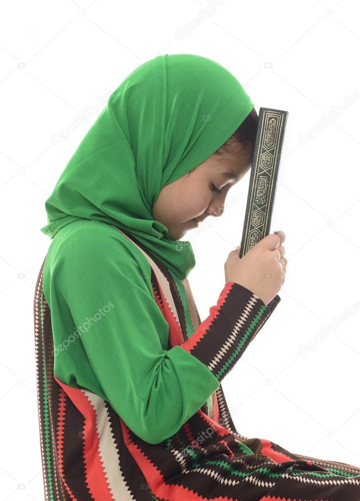 Little Young Muslim Girl Holding Quran