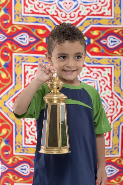 Menino jovem adorável com lanterna Ramadan olhando para longe — Fotografia de Stock