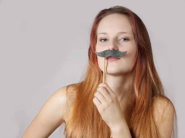 Young woman with fake moustache — Stock Photo, Image