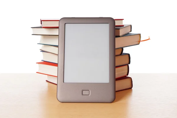 Ebook reader vs pile of books — Stock Photo, Image