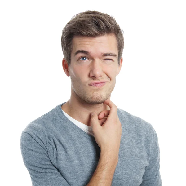 Young man scratching his head — Stock Photo, Image