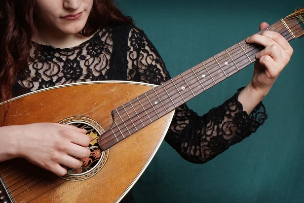 Female playing lute string instrument — Stock Photo, Image