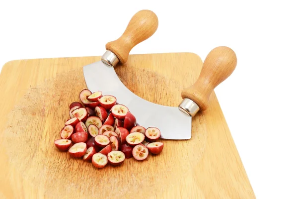 Chopped fresh cranberries with a rocking knife — Stock Photo, Image