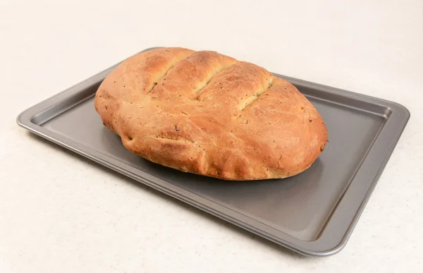 Freshly baked bread with slashed crust — Stock Photo, Image