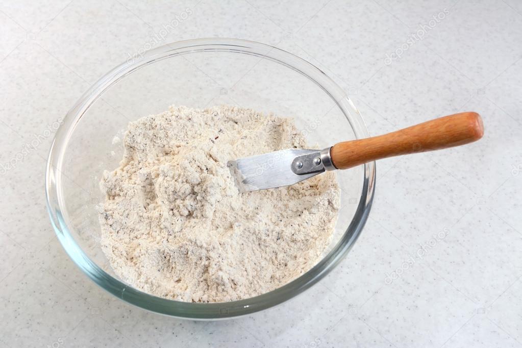 Mixing bread flour mix and butter with a knife