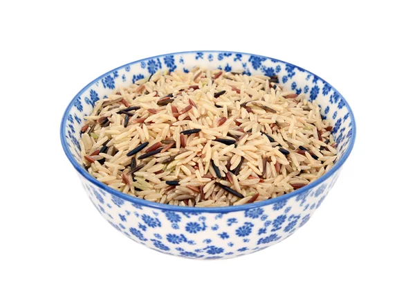 Смешанные рисовые зерна в сине-белой чаше фарфора — стоковое фото