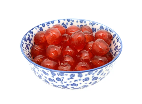 Glace cherries in a blue and white china bowl — Stock Photo, Image