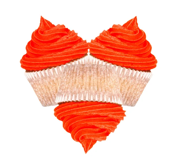 Tres cupcakes con glaseado rojo en forma de corazón —  Fotos de Stock