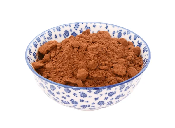 Cocoa powder in a blue and white china bowl — Stock Photo, Image