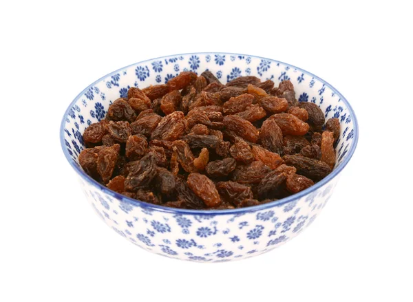 Sultanas in una ciotola di porcellana blu e bianca — Foto Stock