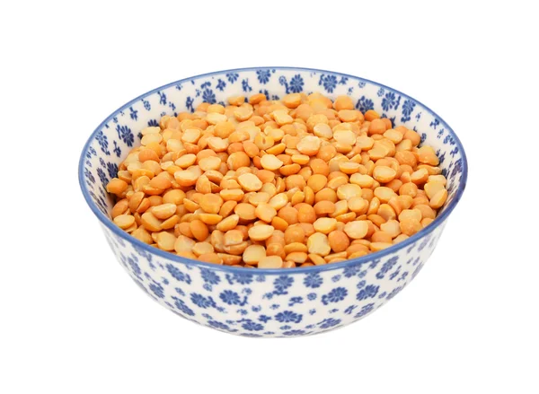 Yellow split peas in a blue and white china bowl — Stock Photo, Image