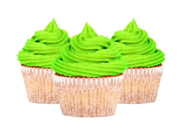 Três cupcakes com cobertura verde — Fotografia de Stock