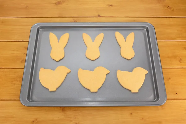 Baking tray with six Easter cookies — Stock Photo, Image