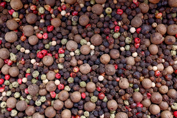 Mixed peppercorns background — Stock Photo, Image