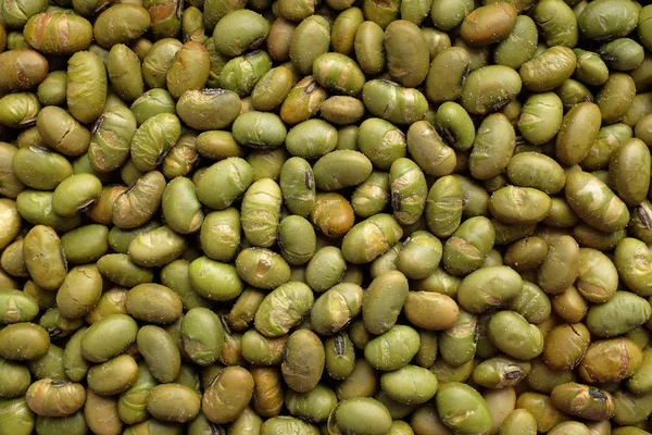 Geroosterde gezouten soja noten achtergrond — Stockfoto