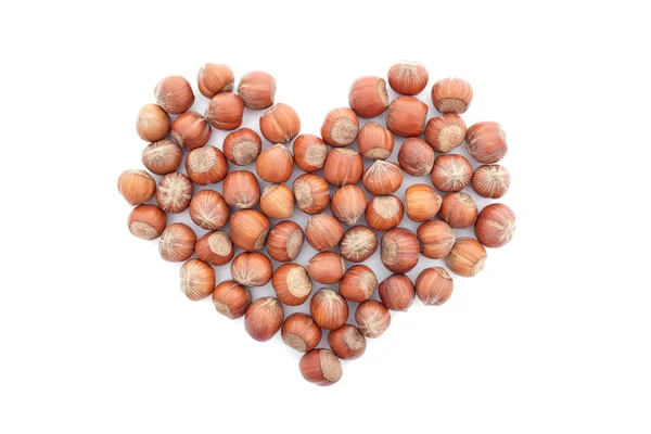 Hazelnuts in a heart shape Stock Photo