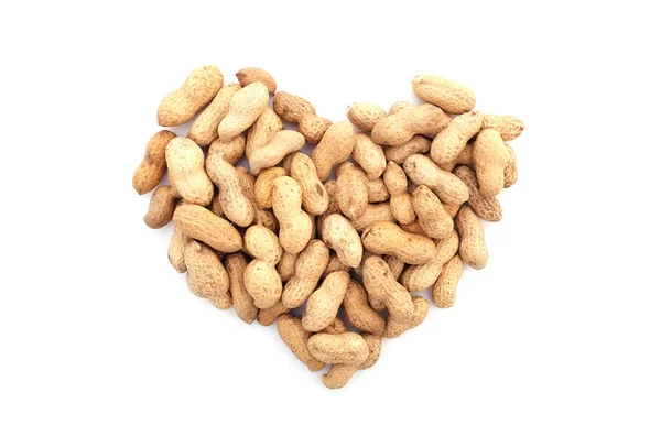 Monkey nuts in a heart shape — Stock Photo, Image