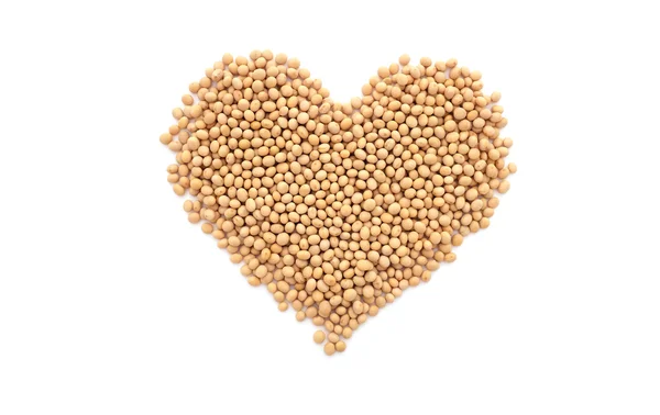 Soybeans, or soya beans, in a heart shape — Stock Photo, Image