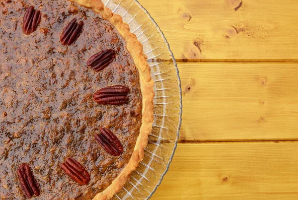 Half pecan pie served on a glass plate — Stock Photo, Image