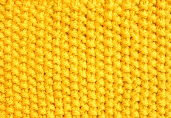 Knitting in moss stitch with yellow yarn — Stock Photo, Image