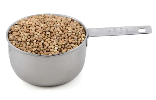 Hemp seeds in a measuring cup — Stock Photo, Image